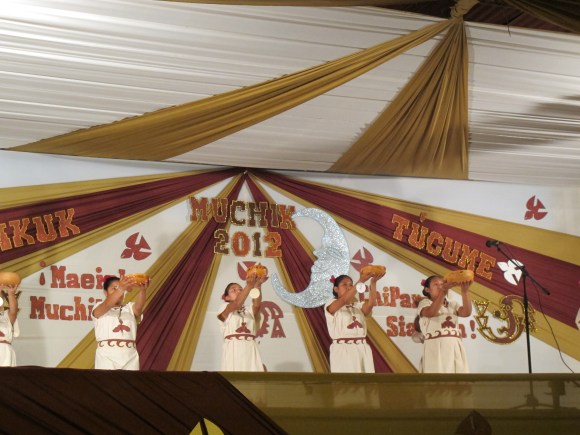 the ladies doing their introductions. the girls wore traditional dresses and used gords as props. 